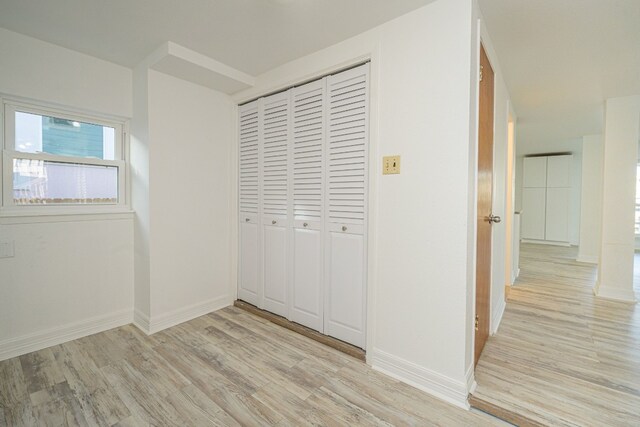 246 Starboard Ave, Rockport, TX 78382 - unfurnished bedroom with light wood finished floors, a closet, and baseboards