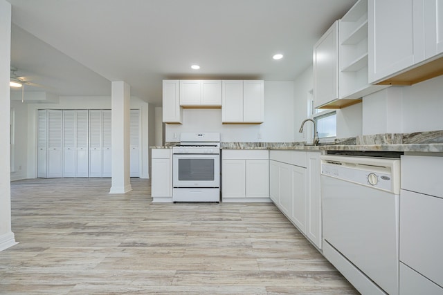246 Starboard Ave, Rockport, TX 78382 - kitchen featuring white appliances, open shelves, ceiling fan, light wood-style flooring, and white cabinetry