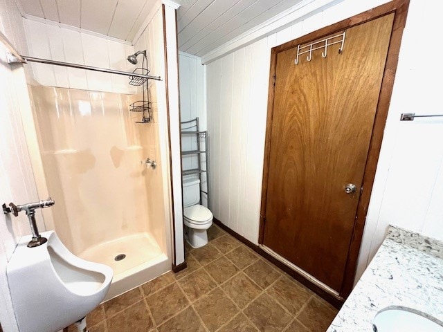 246 Starboard Ave, Rockport, TX 78382 - bathroom featuring a stall shower, toilet, and a sink