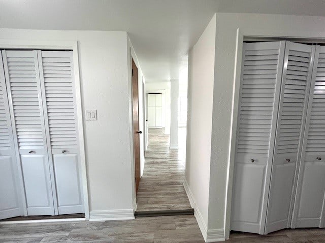 246 Starboard Ave, Rockport, TX 78382 - hallway featuring baseboards and wood finished floors