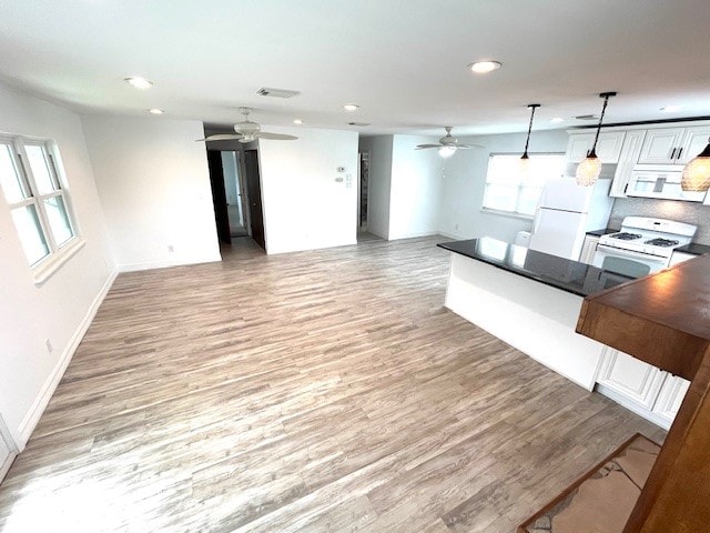 246 Starboard Ave, Rockport, TX 78382 - unfurnished living room featuring ceiling fan, light wood-type flooring, and recessed lighting