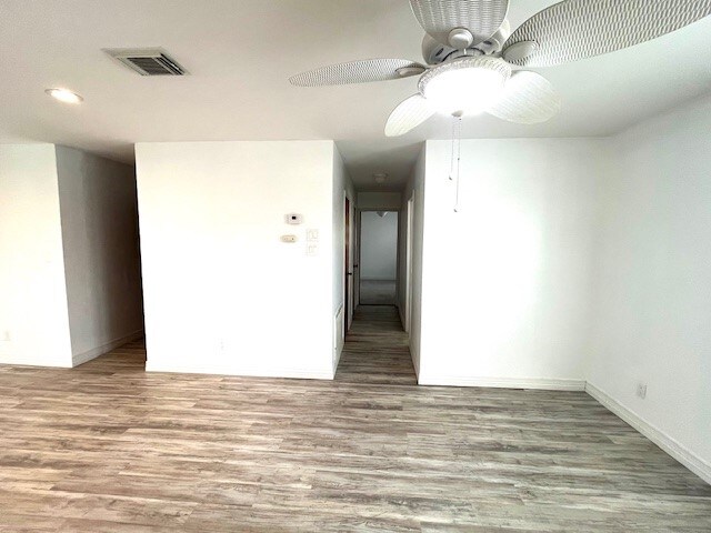 246 Starboard Ave, Rockport, TX 78382 - unfurnished room featuring wood finished floors, baseboards, and ceiling fan