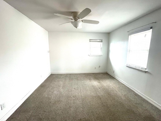 246 Starboard Ave, Rockport, TX 78382 - carpeted spare room with a ceiling fan and baseboards