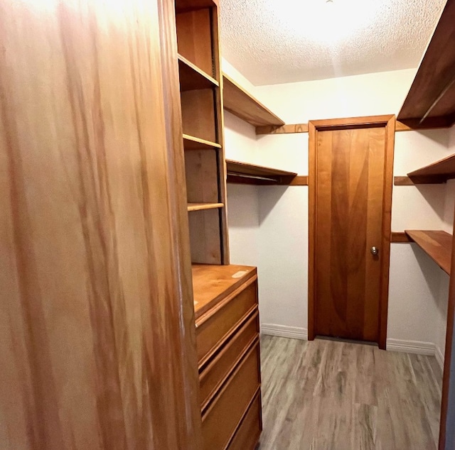 246 Starboard Ave, Rockport, TX 78382 - walk in closet featuring wood finished floors