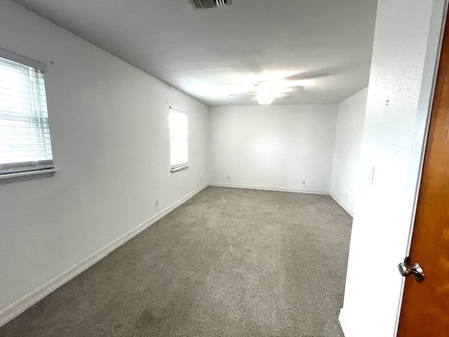 246 Starboard Ave, Rockport, TX 78382 - carpeted empty room featuring ceiling fan and baseboards