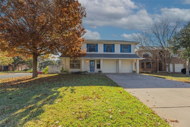 view of front of home featuring a front yard and a garage