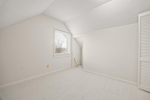 bonus room with carpet and lofted ceiling