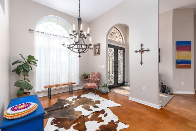 foyer featuring a chandelier