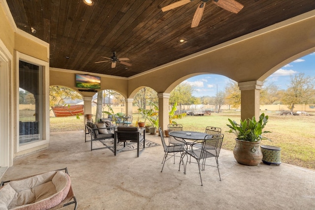 view of patio featuring ceiling fan