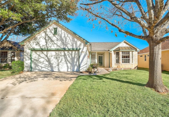 view of front of home featuring a garage and a front lawn