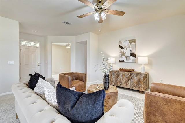 carpeted living room featuring ceiling fan