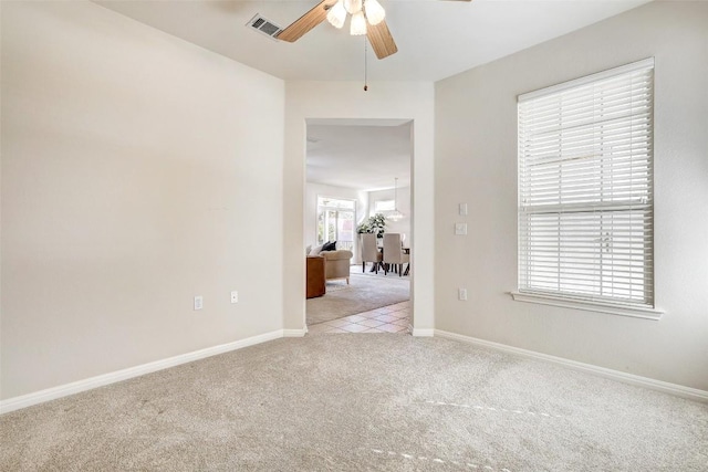 carpeted empty room with ceiling fan