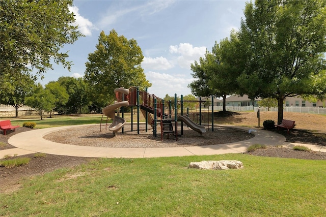 view of jungle gym with a lawn