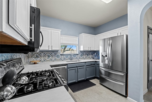 kitchen featuring gray cabinets, sink, white cabinetry, and stainless steel appliances