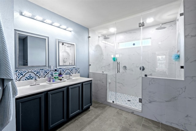 bathroom with vanity and a shower with shower door