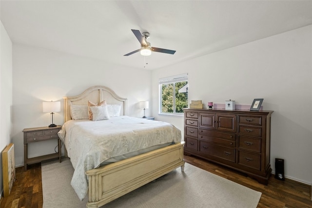 bedroom featuring dark hardwood / wood-style flooring and ceiling fan