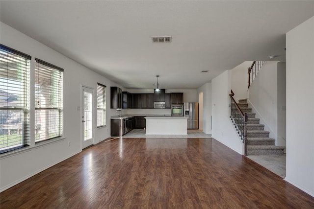 unfurnished living room with light hardwood / wood-style flooring