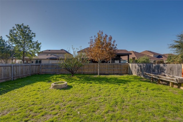 view of yard featuring a fire pit