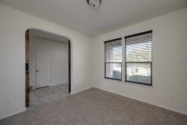 empty room with light colored carpet