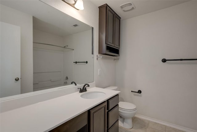 bathroom featuring a shower, vanity, and toilet