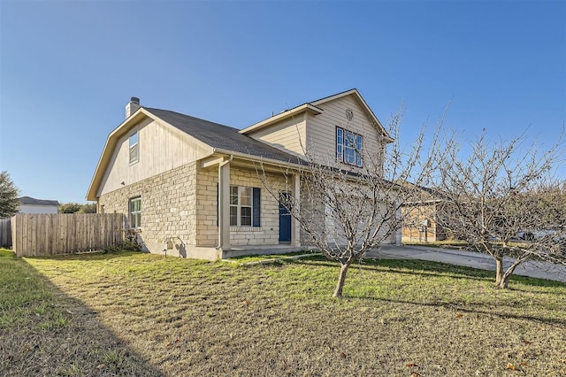 view of front of property with a front yard and a garage