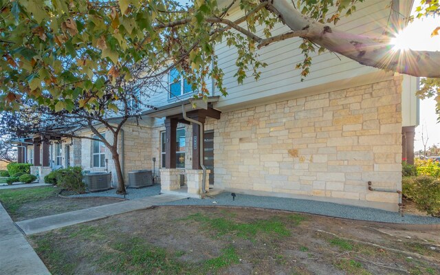 view of home's exterior with central AC unit