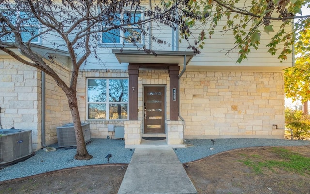 entrance to property with central AC unit