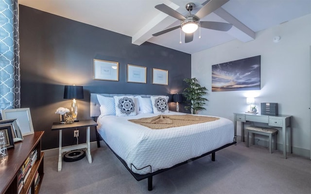 bedroom featuring carpet, ceiling fan, and beam ceiling