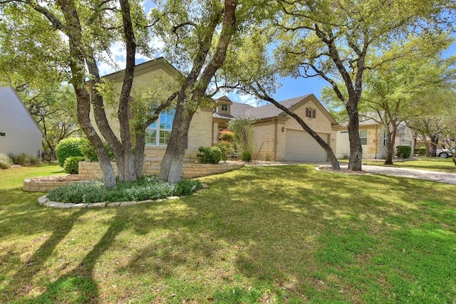 view of front of property with a garage and a front lawn