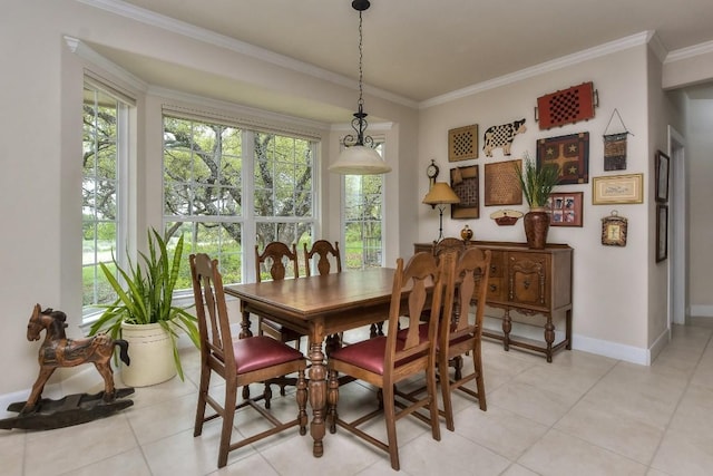 tiled dining area featuring crown molding