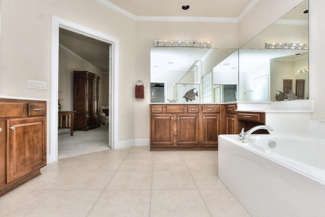 bathroom with tile patterned flooring, a bathing tub, and ornamental molding