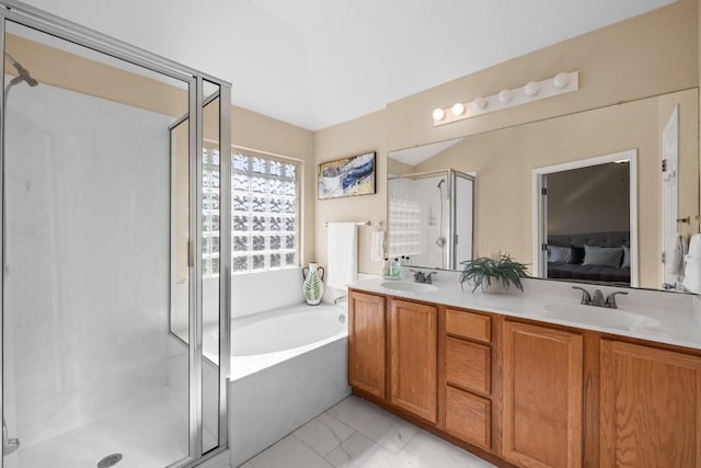 bathroom featuring separate shower and tub and vanity