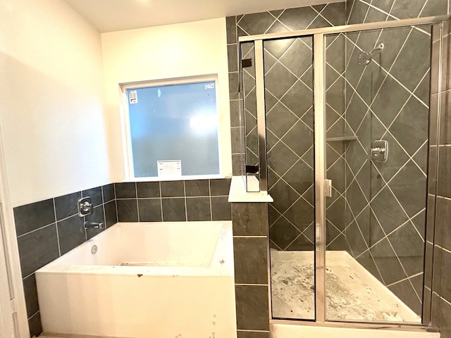 bathroom with shower with separate bathtub