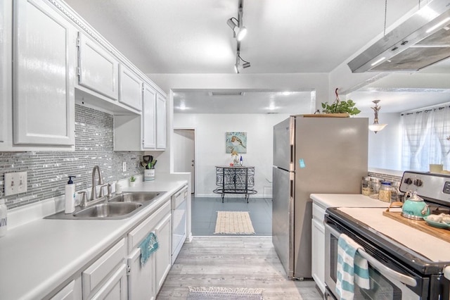 kitchen featuring white cabinetry, sink, stainless steel appliances, decorative light fixtures, and exhaust hood