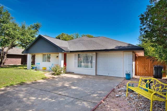 single story home with a garage and a front yard