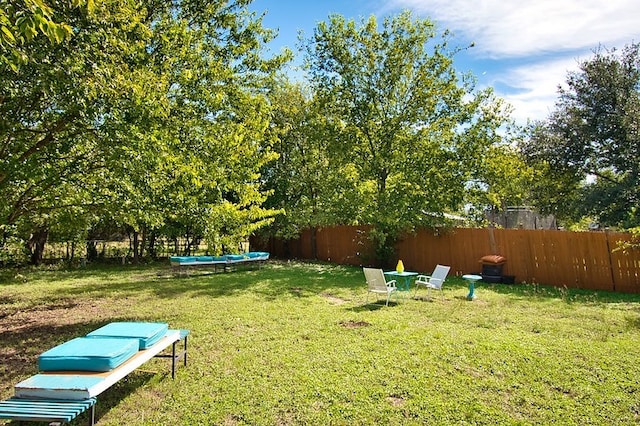 view of yard featuring a trampoline