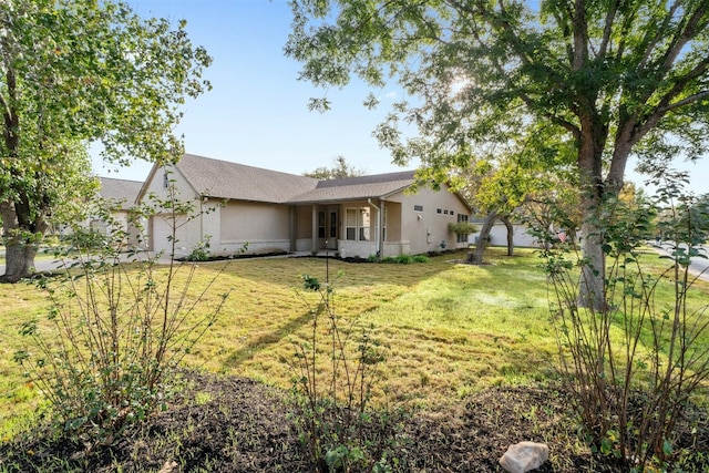 exterior space featuring a garage and a front yard