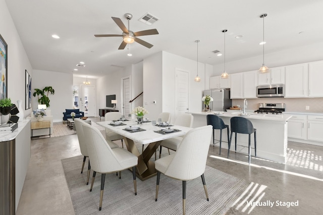 dining area with ceiling fan