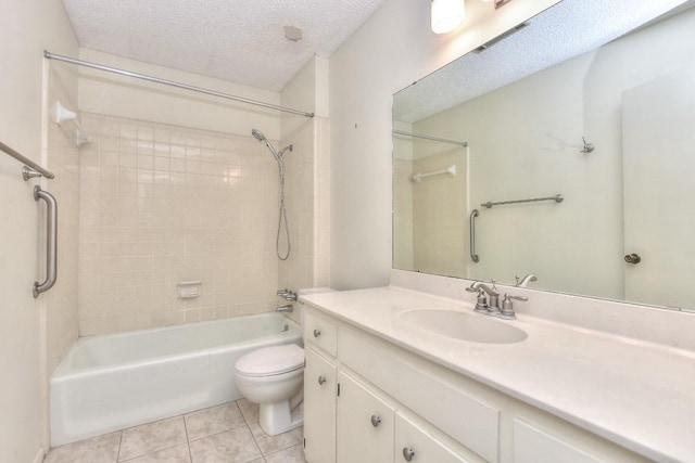 full bathroom featuring vanity, tile patterned floors, shower / washtub combination, toilet, and a textured ceiling