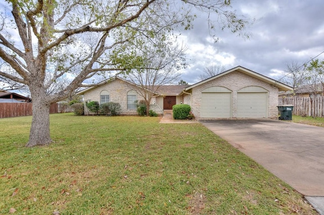 single story home featuring a garage and a front lawn