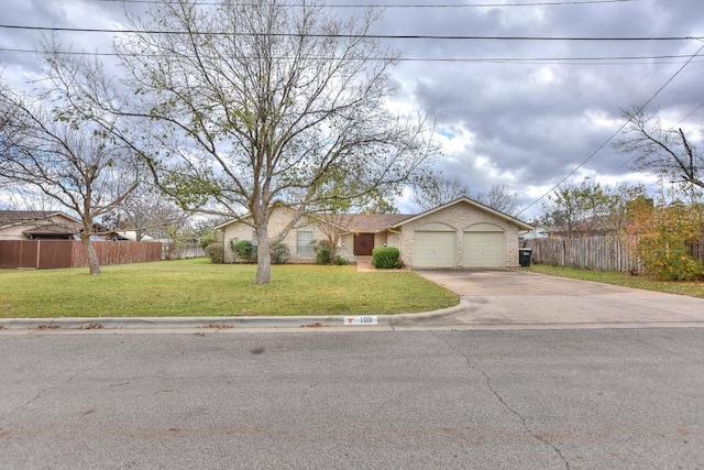 view of front facade with a front yard and a garage