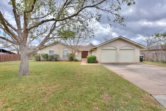 single story home with a garage and a front yard