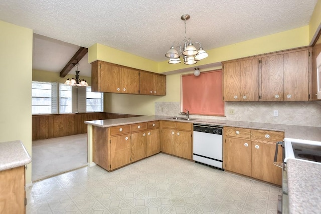 kitchen with stove, white dishwasher, sink, decorative light fixtures, and a chandelier