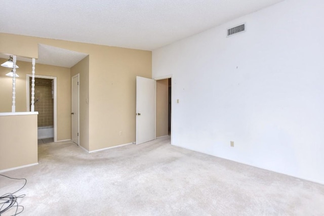 unfurnished room featuring light colored carpet