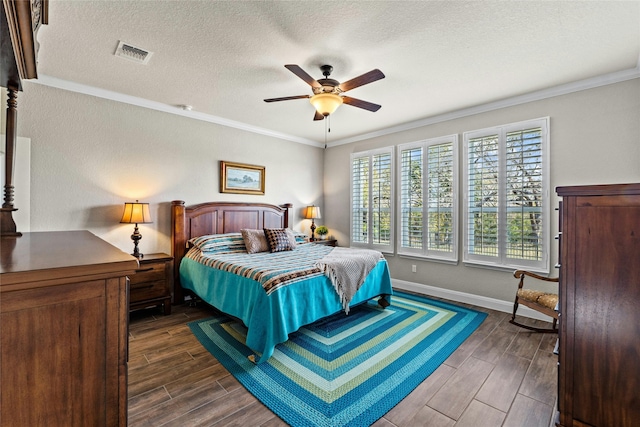 bedroom featuring wood finish floors, visible vents, ornamental molding, a textured ceiling, and baseboards