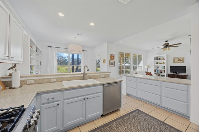 kitchen featuring decorative light fixtures, stainless steel appliances, sink, ceiling fan, and light tile patterned floors