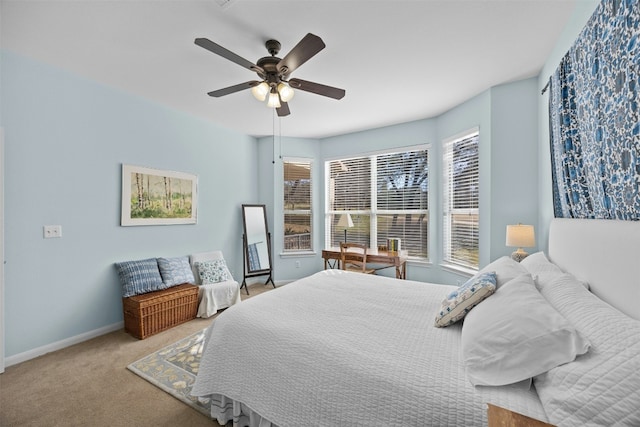 bedroom featuring ceiling fan and light colored carpet