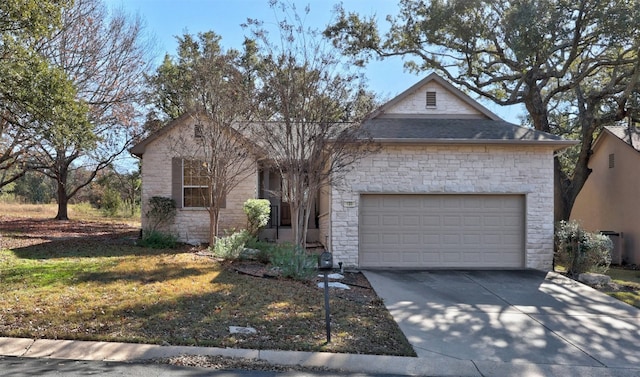 view of front of property featuring a front lawn and a garage