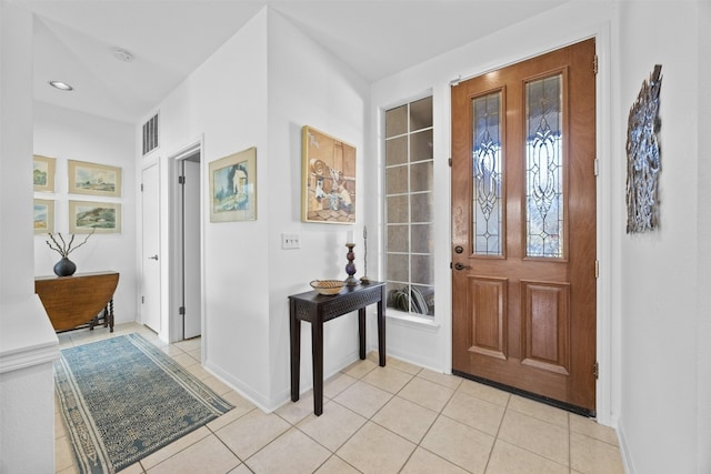 foyer entrance featuring light tile patterned floors