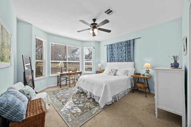 bedroom featuring ceiling fan and carpet